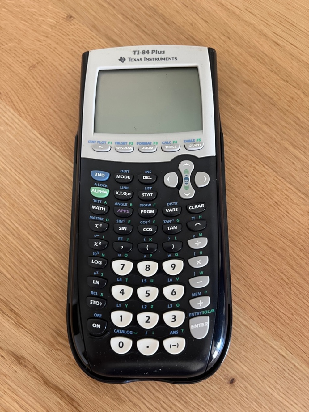 Texas Instruments TI-84 Plus Graphing Calculator in Black and White